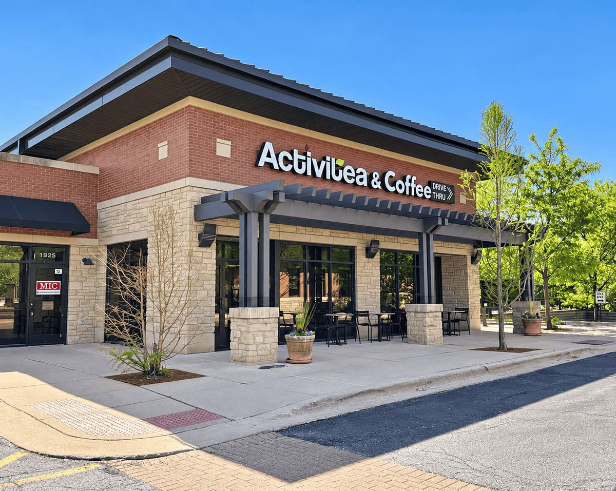 The entrance to Activitea Coffee in Wheaton at dusk